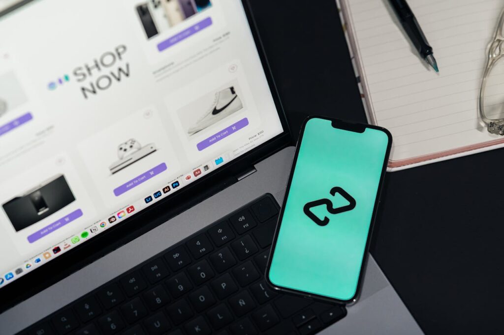 Mastering the First Impression: Your intriguing post title goes here A smartphone and laptop displaying online shopping platforms, suggesting digital retail.